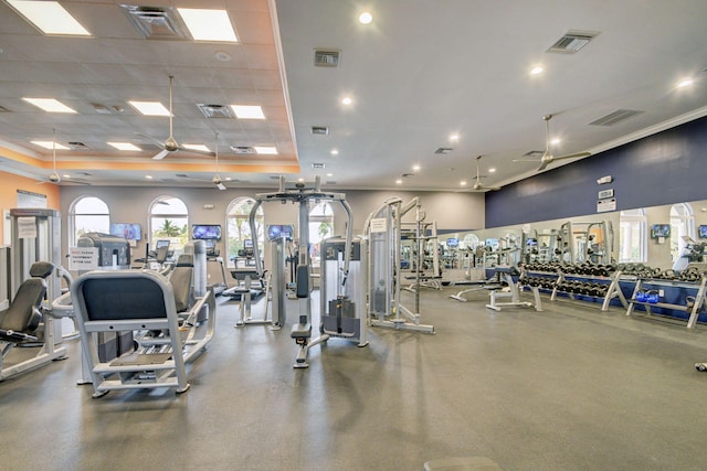 gym with ceiling fan and a drop ceiling