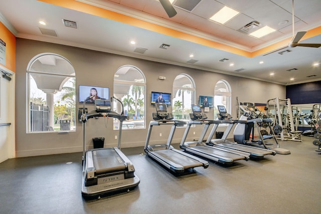 exercise room with crown molding and a wealth of natural light