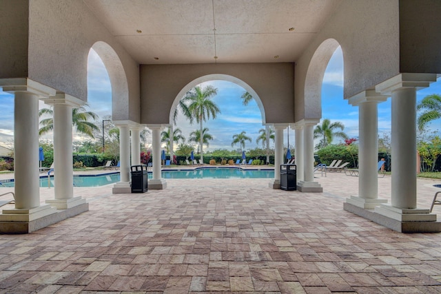 view of swimming pool with a patio