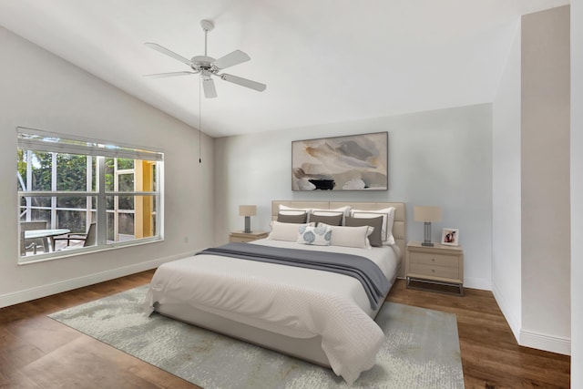 bedroom featuring dark hardwood / wood-style floors, ceiling fan, and lofted ceiling