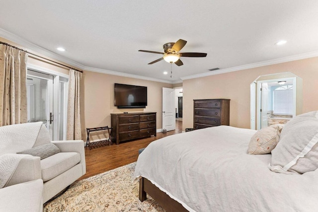 bedroom with ensuite bath, ceiling fan, wood-type flooring, and ornamental molding