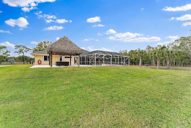 back of house with a gazebo, a patio area, and a lawn