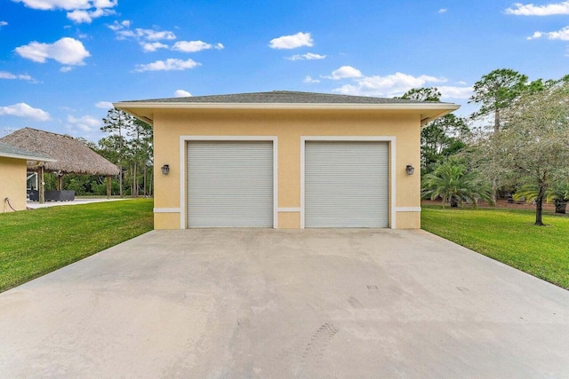 garage featuring a yard