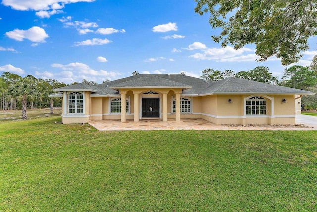 rear view of property featuring a yard