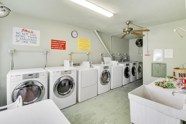 laundry area featuring washing machine and dryer, ceiling fan, and sink