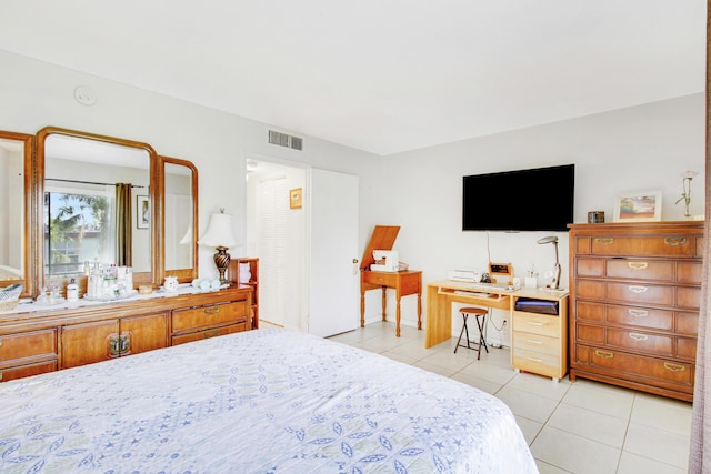 bedroom featuring light tile patterned floors