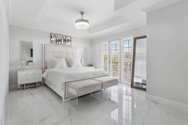 bedroom with a tray ceiling, access to exterior, and ornamental molding