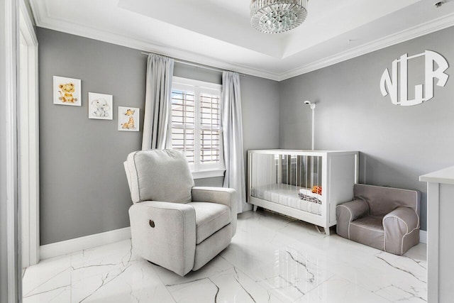 bedroom with a raised ceiling, crown molding, a nursery area, and a notable chandelier