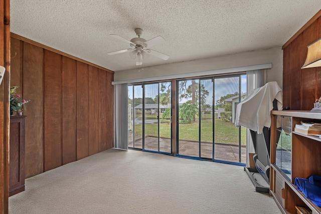 interior space featuring ceiling fan