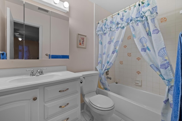 full bathroom featuring vanity, toilet, and shower / tub combo with curtain