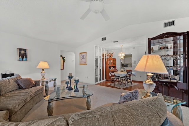 living room with ceiling fan and lofted ceiling