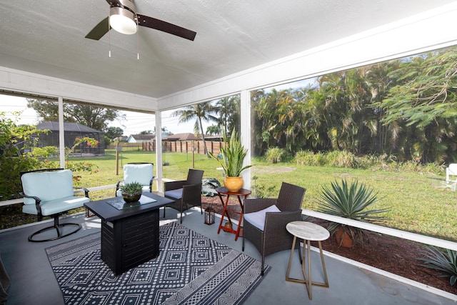 sunroom / solarium with ceiling fan