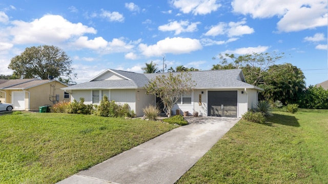 ranch-style house featuring a garage and a front lawn