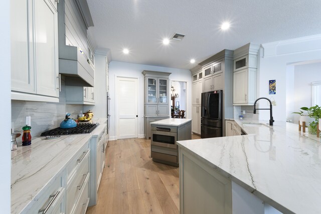 bedroom featuring light hardwood / wood-style floors and crown molding