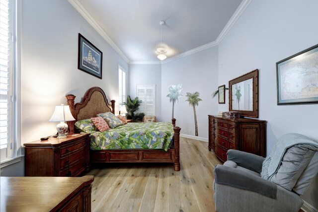 bedroom with hardwood / wood-style flooring, ceiling fan, and ensuite bathroom