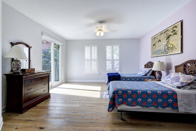 bedroom with ceiling fan, access to outside, and light hardwood / wood-style flooring