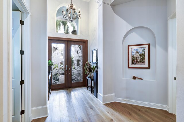 kitchen featuring a center island, sink, decorative light fixtures, kitchen peninsula, and stainless steel appliances