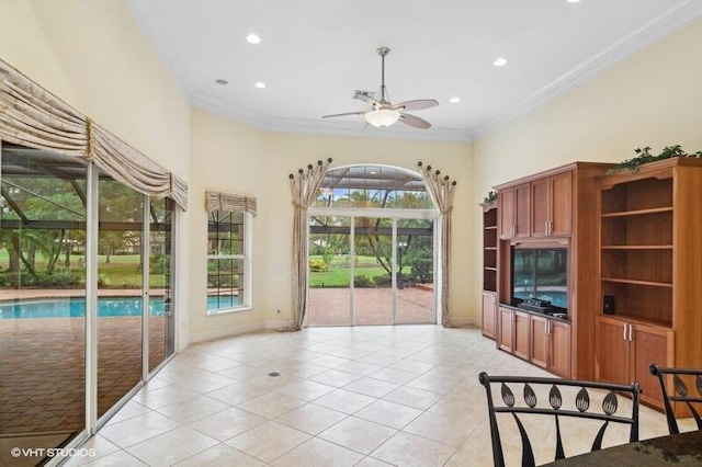 tiled living room featuring ceiling fan and ornamental molding