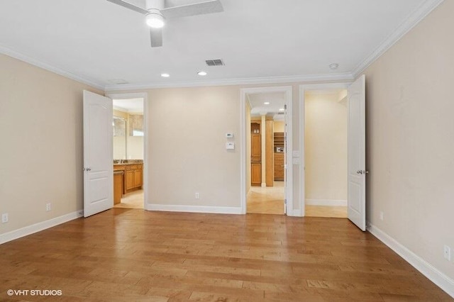 unfurnished room with ceiling fan, light hardwood / wood-style flooring, and ornamental molding