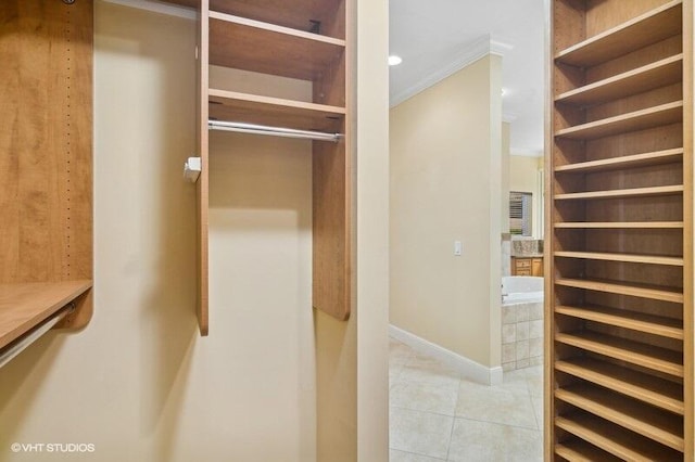 spacious closet featuring light tile patterned floors