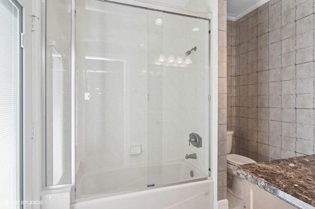 bathroom featuring toilet and tub / shower combination