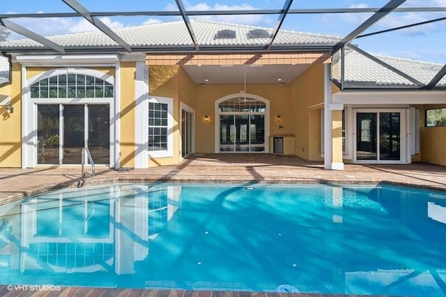 back of property featuring a patio and a lanai