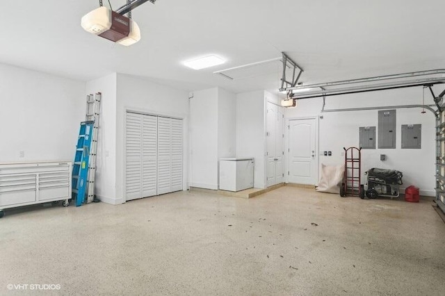 garage featuring electric panel and a garage door opener