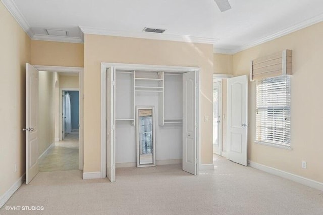 unfurnished bedroom with light colored carpet, a closet, ornamental molding, and ceiling fan