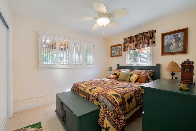 carpeted bedroom with ceiling fan