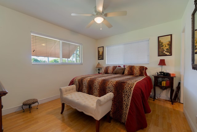 bedroom with light wood-type flooring and ceiling fan