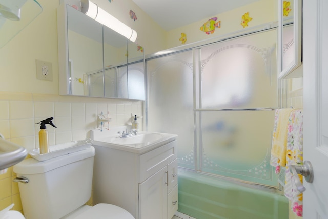 1503 Shirley Ct, Lake Worth, FL 33461 - bathroom with toilet, enclosed tub / shower combo, vanity, tile walls, and tasteful backsplash