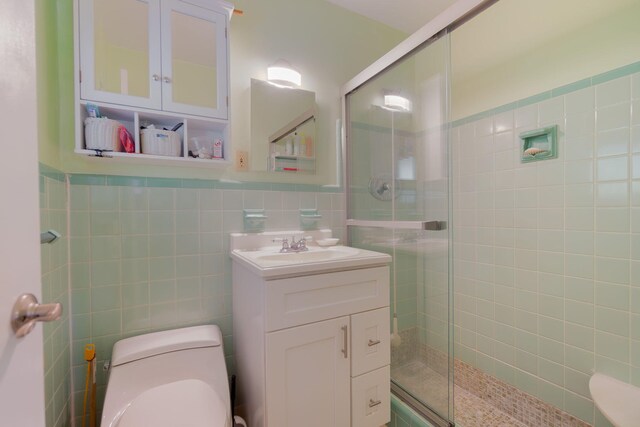1503 Shirley Ct, Lake Worth, FL 33461 - bathroom featuring toilet, tile walls, a stall shower, and vanity