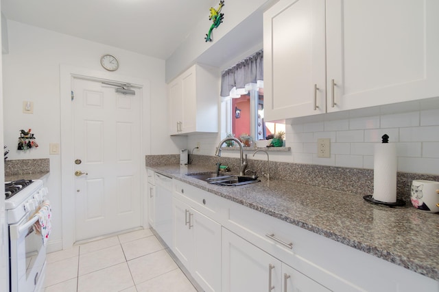 1503 Shirley Ct, Lake Worth, FL 33461 - kitchen featuring a sink, white appliances, white cabinetry, and tasteful backsplash