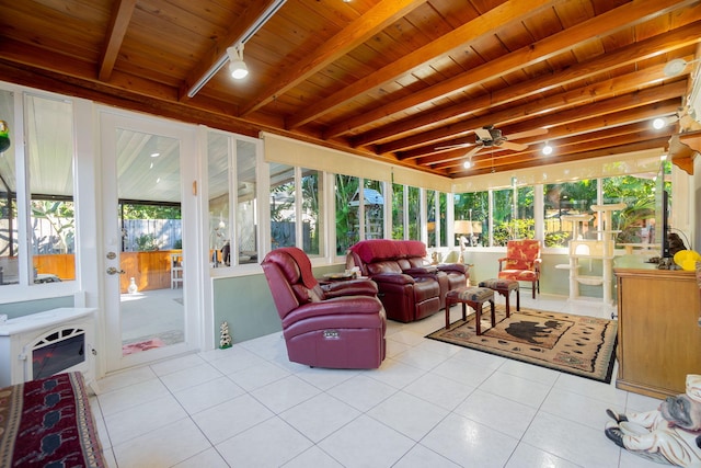 sunroom featuring beam ceiling, track lighting, ceiling fan, and wood ceiling