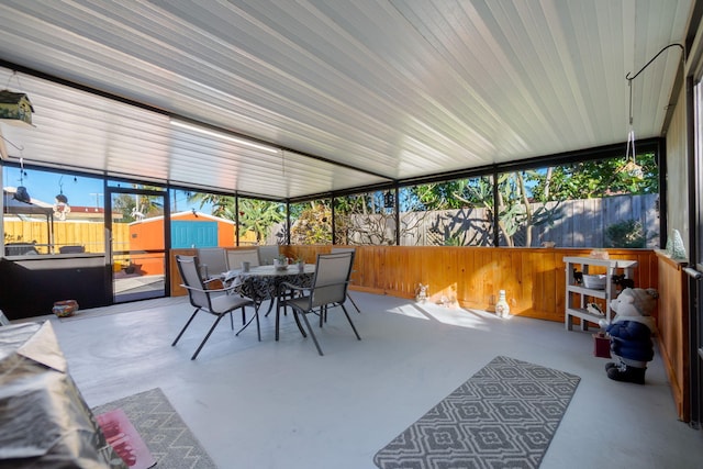 sunroom / solarium featuring a healthy amount of sunlight