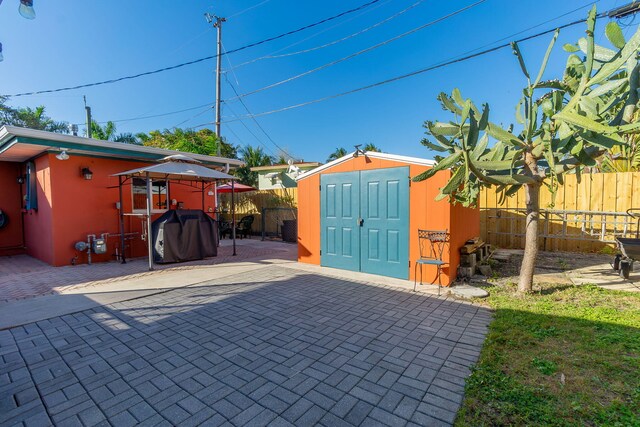 1503 Shirley Ct, Lake Worth, FL 33461 - fenced backyard featuring a patio area and a gazebo