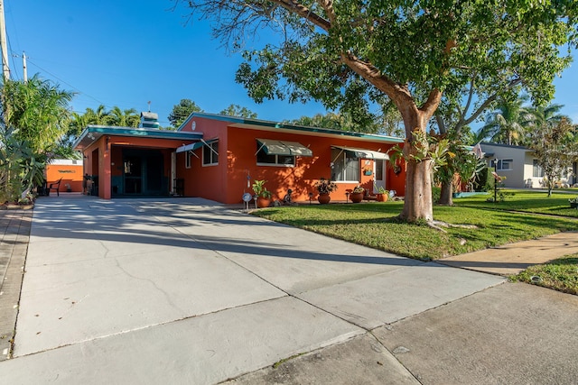 single story home with a carport and a front lawn