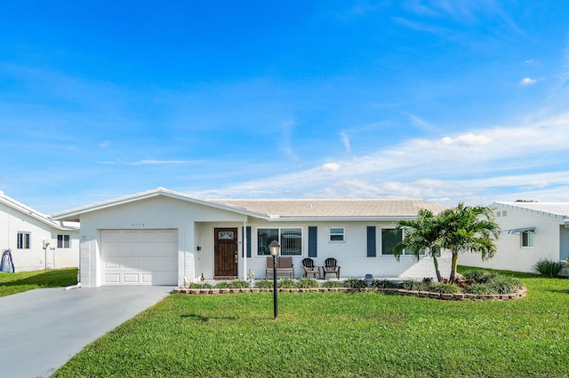 single story home featuring a garage and a front lawn