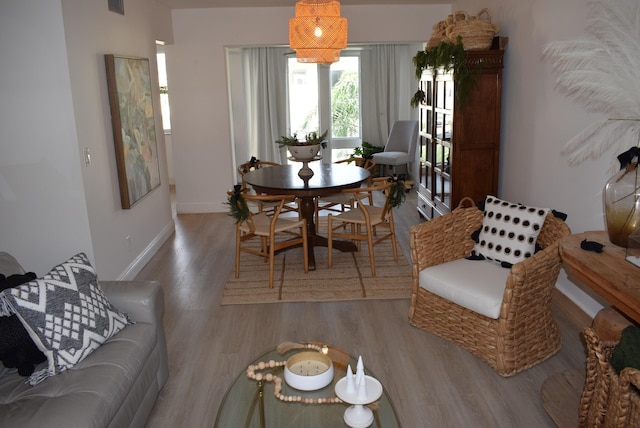 dining space with light hardwood / wood-style floors