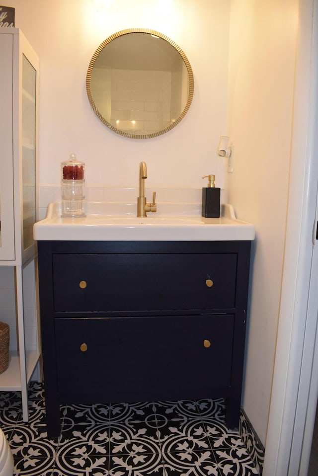 bathroom featuring tile patterned flooring and vanity