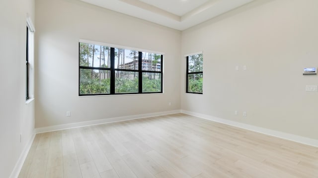 spare room featuring light hardwood / wood-style floors