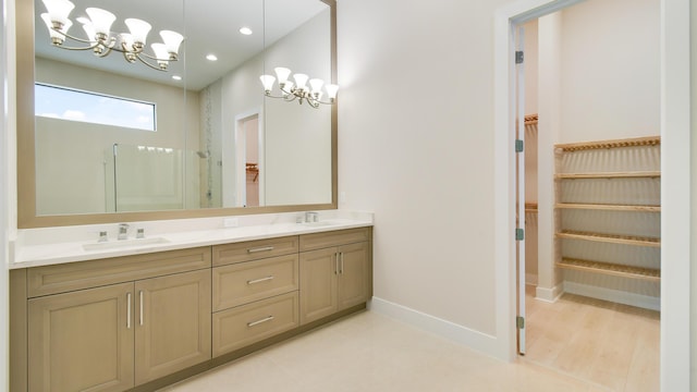 bathroom with vanity and a shower with shower door