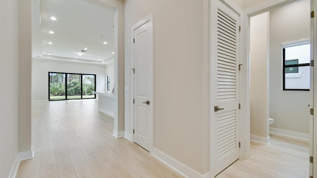 corridor with light wood-type flooring