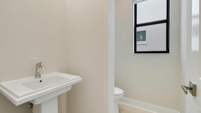 bathroom with sink and toilet