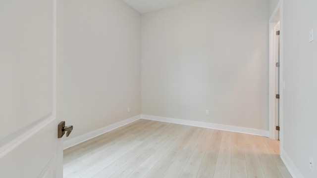 spare room with light hardwood / wood-style floors