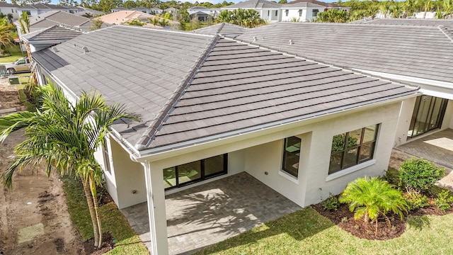 rear view of house featuring a patio