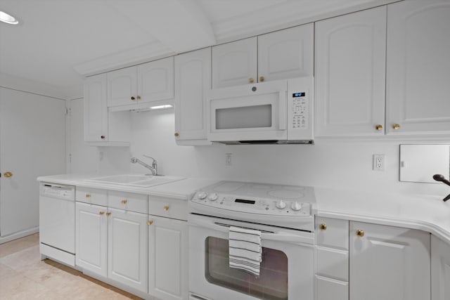 kitchen with white appliances, white cabinetry, crown molding, and sink