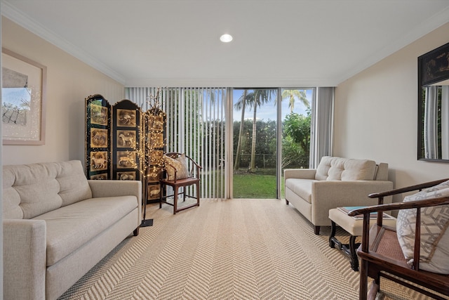 living room with expansive windows and ornamental molding