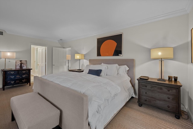 bedroom with ensuite bath, crown molding, and light carpet