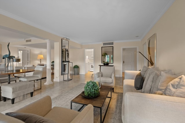 living room with decorative columns and ornamental molding